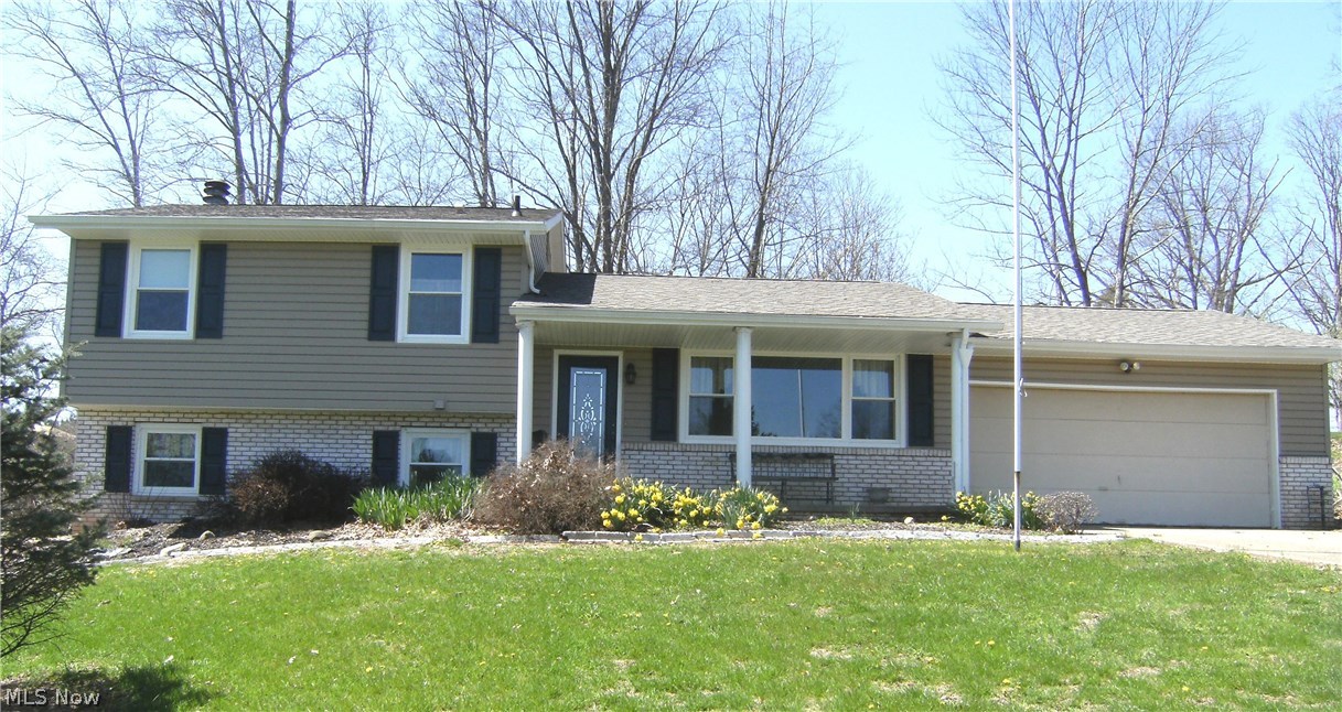 Located just 4.5 miles from the Seneca Lake Marina on 3.25 acres this quad level home on a secluded cul-de-sac has many updates. In 2016 the owner made the following investment; new tilt-in windows, a new roof, new gutters with gutter guard, a new deck and vinyl siding with 1.25 inch thick insulation for optimal energy efficiency. The first floor includes the living room, dining area and an updated kitchen. The two car garage is accessible from the kitchen which makes unloading groceries very convenient. Adjacent to the kitchen, the dining area features a French door leading to a private deck.  A lower level has sun lit family room which features a brick fireplace with wood stove insert, and a walkout leading to a concrete patio and hot tub. This level also feature a fourth bedroom and a convenient half bath. The upper level has three bedrooms, with ample closet space and a full bath. The basement provides lots of space for the laundry area and storage. If you are looking for a home on