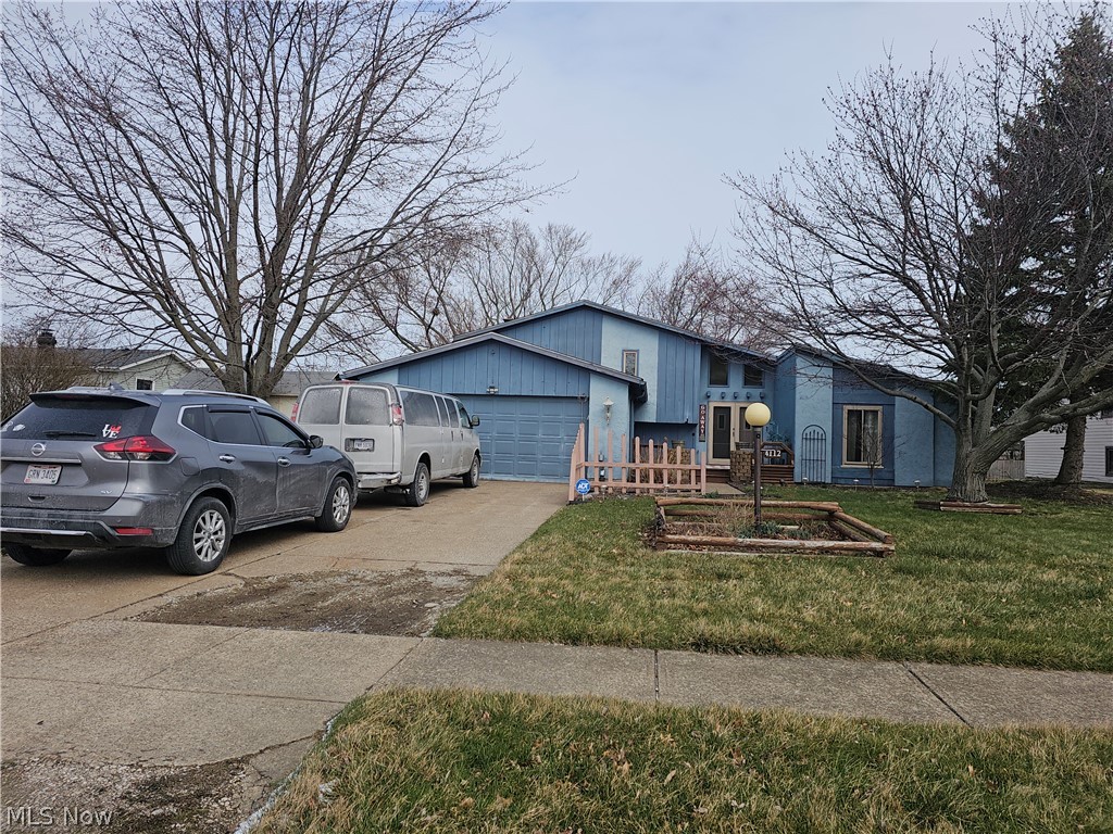 Spacious Split-Level with Great Potential in Lorain!

Bring your ideas and a little elbow grease to make this spacious 4-bedroom, 2-bath split-level home your own. One of the larger homes in the neighborhood, this property offers plenty of living space with vaulted ceilings in the main entrance, front room, and dining area that create an open, airy feel.

The layout provides room to spread out, featuring generously sized bedrooms, a large back deck, and a fenced-in backyard that’s perfect for outdoor enjoyment. The 2-car garage is a great bonus, offering ample storage and convenience. The home is dated but livable, allowing you to move in and update over time at your own pace.

This home is priced below market value to reflect the need for cosmetic repairs and TLC, and offers a great opportunity for someone comfortable with doing their own updates. With good bones, tons of space, and strong potential, this Lorain split-level is ready for its next owner to make it shine again.