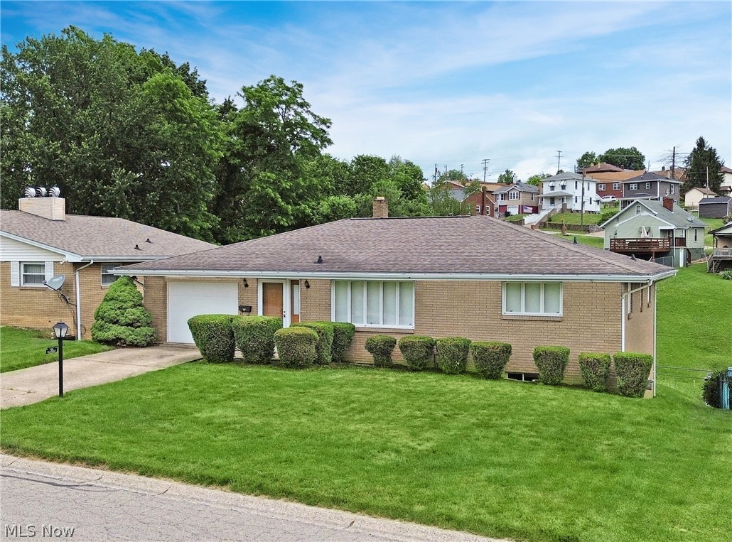 Welcome to this well-maintained 3-bedroom, 2-bath brick ranch located in a convenient Steubenville neighborhood close to shopping, restaurants, schools, medical facilities, and other everyday amenities. Offering timeless curb appeal and solid brick construction, this home is full of character, comfort, and opportunity.

Step inside to find a bright and inviting living room filled with natural light, a spacious eat-in kitchen with abundant cabinet and countertop space, and three generously sized bedrooms. The functional floor plan provides plenty of room for everyday living while maintaining a warm and welcoming feel throughout.

Outside, you'll enjoy a unique backyard setting that offers multiple levels of usable outdoor space. The area directly behind the home is ideal for relaxing, entertaining, or outdoor gatherings, while the lower portion of the property provides additional open green space with a peaceful creek running through it, creating a scenic backdrop and plenty of room to enjoy the outdoors.

Whether you're a first-time buyer, looking to downsize, or searching for a quality home in a great location, this property offers exceptional value and plenty of possibilities. Don't miss your opportunity to make this charming brick ranch your next home—schedule your private showing today!