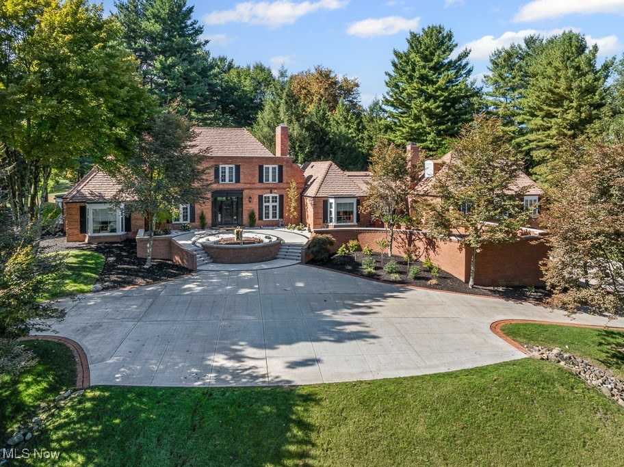 Stunning French Colonial estate on 2.03 acres in Hills and Dales, Canton’s most coveted neighborhood. This spacious 5-bedroom home includes 7 bathrooms (5 full, 2 half), and a generous first-floor suite with a beautifully updated bath. Multiple living and entertaining spaces include a cozy family room, sitting room, formal living and dining rooms, and a chef’s dream eat-in kitchen.
The lower level offers exceptional square footage with a second family room and fireplace, gaming rooms, exercise room, hot tub, sauna, full bath, and an indoor saltwater pool beneath a breathtaking 30-ft solid redwood dome ceiling—convertible to a basketball court. Outside, enjoy a professionally landscaped oasis perfect for entertaining.
Recent renovations include:
•  Tree removal and fresh landscaping for enhanced curb appeal
•  New shutters and rebuilt steps/sidewalks with lighting
•  Restored sprinkler system
•  Custom water feature at entry
•  Expanded foyer and redesigned entrance
•  Glass sliding doors at pool access
•  New outdoor faucets
•  All rugs removed, hardwood floors restored
•  Full kitchen demo and remodel
•  Updated guest and master showers
•  New flooring in kitchen, bedrooms, and lower level
•  Ceiling lights in all rooms
•  Fresh paint throughout
•  Two new washers and dryers
•  New pool filter and pump

Additional upgrades: 98% LED lighting, three furnaces and three A/C units (2018), whole-house Generac 50KW generator, and a DaVinci Amish Shake roof (2019) with Lifetime Warranty. A rare opportunity to own a fully updated home in a premier location.
