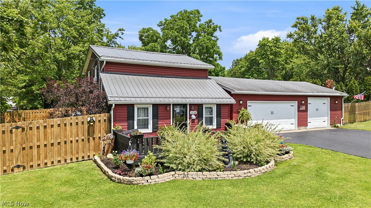 Adorable 1100 Sq. Ft. Bungalow, completely renovated and updated, close to the lake, move in ready! Owners have redone everything in this home. All new plumbing, completely re-wired, with new added insulation. Kitchen has redone cabinetry, in a warm forest green color, laminate counters, new LTV laminate floors and A/C in the window. All appliances stay. Laundry room on main floor, as well as full bath with shower tub combo. Living room has been redone in ship lap, and has a pellet stove, that warms the entire home in the winter. Also, Hydronic oil filled baseboard heating. Three bedrooms up with A/C unit in the hall. Newer siding and metal roof on the home. Beautiful landscaping front and back. The back yard is your own private oasis, decks, flowers, above ground pool, large sheds, and totally fenced in yard for privacy. Comes  gasDrive was just re-sealed. Then there is the garage, 3 cars,  with extra space, workbench, an auto mechanic’s dream.  Docks are available at the State Office.