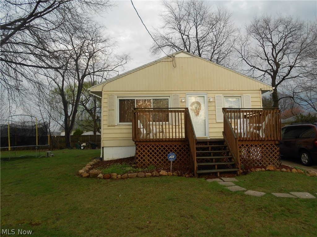 Adorable and affordable!  Well maintained 2 bedroom ranch has an open floor plan and partially finished basement.  This home offers many updates including newer roof (2006 - tear off), electrical (2013), all newer windows, water line (2014) and full bath.  In the master bedroom you'll find a large closet and hardwood floors. There are also hardwood floors under the 2nd bedroom and living room carpets.  Located on a quiet street this ranch sits back on the lot and has a nice front and back deck.  This property has an extra parcel of land, is in the Ellet school district and is close to shopping and highways.  Not a drive by. Home warranty being offered by the sellers for peace of mind.