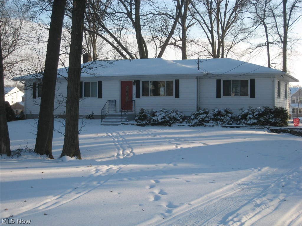 Welcome to this exceptional ranch!  Beautifully refinished hardwood floors catch you eye as you enter the front door.  Natural light softly filters through the newer windows throughout.  Amazing 24 x 16 family room is waiting for your large flat screen TV and entertainment system.  Thinking about theater chairs or a spacious sectional?  No worries, it will all fit.  The fully applianced kitchen with ample counter space and dining area are just steps away overlooking the private back yard and deck with new railings and stairs down to the yard. The master bedroom features a triple closet with organizer system and its own half bath, recently remodeled with vanity, sink, lighting and flooring.  Two other nice size bedrooms each with double closets.  The main bath is completely updated with beautiful tile and glass tile insert, vanity with Kohler bowl sink perched on the granite countertop, lighting and wood grain tile floor. Other improvements include furnace-2007, hot water tank-2010, 200