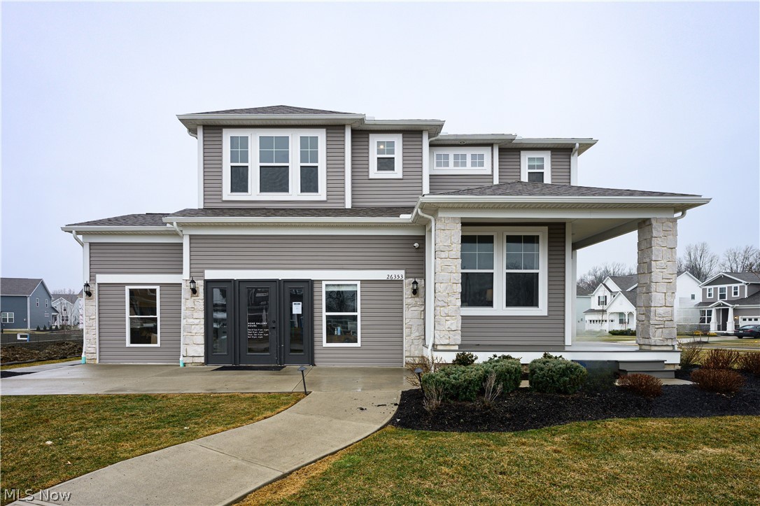 Stunning 4 Bedroom/2.5 Bath MODEL HOME in Olmsted’s desirable Preserve community! This meticulously maintained model home features a large kitchen with quartz countertops and stainless-steel appliances, flowing into a bright family room equipped with a stone fireplace.  The 3rd car garage adds an expanded driveway and extra space for storage. The second level boasts carpeting and an expansive master suite featuring a large walk-in closet and private suite bath. Outdoor living is elevated by an expansive maintenance free lighted deck. Located in a top-rated school district just minutes from Downtown Olmsted Falls and Crocker Park, this move-in-ready gem combines premium upgrades with an unbeatable location. Schedule your private showing today!