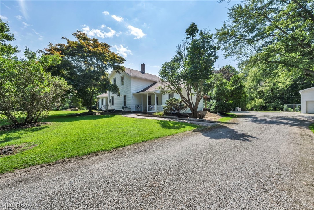 Introducing an extraordinary single-family home that beautifully blends timeless character with modern comfort. Originally built in 1900, this meticulously maintained 6-bedroom, 3-bathroom residence offers approximately 3,088 square feet of thoughtfully designed living space, where classic craftsmanship meets today's desirable updates.

The updated kitchen features stainless steel appliances, while beautiful tile flooring, elegant molding, and a unique floor plan create warmth and character throughout. The spacious layout includes a first-floor laundry room conveniently located in the heart of the home, a private in-suite bathroom, and flexible living space that offers excellent potential for a home office or an in-law suite.

Situated on 2.32 picturesque acres, the property is surrounded by mature trees and beautifully maintained grounds. Enjoy the custom brick walkways, an inviting side porch, and expansive deck space perfect for relaxing or entertaining. Additional exterior features include an oversized two-story garage and a separate outbuilding that provides ample storage.

This home also offers the added benefit of both a gas well and a water well on the property. Recent updates provide peace of mind and include a newer furnace, central air conditioning, hot water tank, electrical improvements, updated light fixtures, fresh mulch, and more.

Conveniently located near everyday amenities and highly rated schools. This exceptional property offers the perfect balance of privacy, space, and convenience. More than just a home, it's a lifestyle opportunity you won't want to miss.