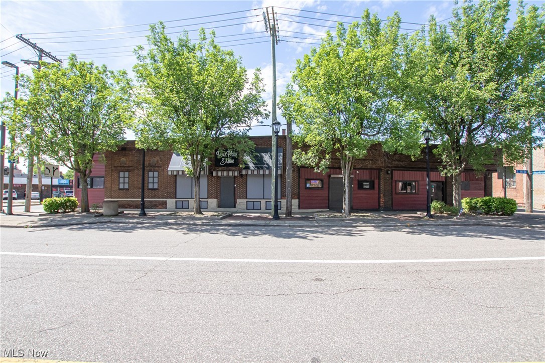 Turnkey opportunity awaits with both Real Estate and business included! Located in the Broadway Historic, District (facing E 55th at Dolloff). Business includes "Your Place and Mine" which is a Bar/Restaurant with a D-4 liquor license. It includes event space with a stage, DJ booth and pool table. Real Estate includes an all brick 3488 SQFT 3-unit strip center with a full basement for 6976 total SQFT. Building has 3 separate entrances and addresses that can be opened up as one space or divided up separately. Currently all 3 units are open. Unit one to the left if facing includes the bar (roughly 2000 SFT). Unit 2 in the middle currently is used as a smoke lounge w/ ventilation and or VIP Lounge that is roughly (750 SQFT). Unit 3 (to the right if facing) has a newly renovated clean commercial kitchen (2020) with equipment, a level 4 food license issued through Cleveland Department of Health. There is also a carry out counter located in the front (roughly 750 SQFT). Street parking out front and huge public parking lot across the street with surveillance. Building has many upgrades HVAC 18, storefront renovation 21 and is in good condition. A must see!