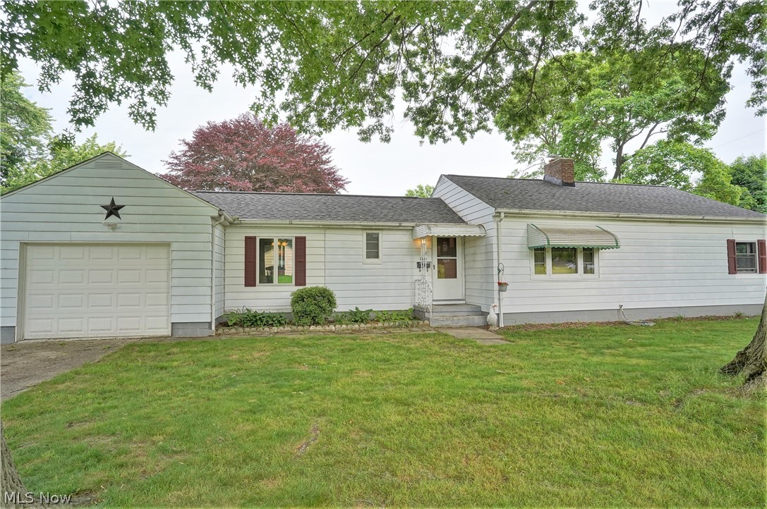 Cute, updated 2-bedroom Ranch on double lot.  Large, fireplaced living room with hardwood floors and rounded doorways, has large picture windows on front and back walls for lots of natural lighting and built-in bookcase, leads to updated, applianced kitchen, complete with Barker cabinets, Wilson Art counters, subway tile backsplash, ceramic flooring, recessed lighting, and pantry with pull-out drawers.  Breeze way has been converted to formal dining room with hardwood floor, sliders to new back steps and backyard. Dining room also has entry to attached 1-car garage for easy grocery unloading out of the weather!  Other end of the house has two nice sized bedrooms with hardwood floors, one with two double closets.  There's also a full, updated bath including new vanity with Corian counter, Kohler deep soaker tub and ceramic floor.  Lower level has woodburning fireplace waiting to be part of finished rec room, with several storage closets and laundry area.  Corner/double lot gives you .27
