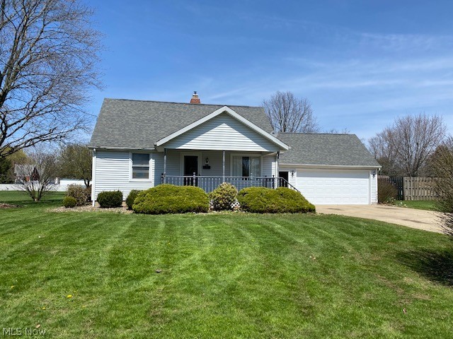 Warm & charming vinyl sided bungalow on nice deep lot.  Cozy front porch leads into this newly remodeled home with luxury vinyl plank flooring, updated kitchen with newer cabinets and appliances, newer carpet, finished rec room with 2nd bath on lower level, updated main bath, 2-1/2 car garage, plus 2 outbuildings.  Central air new 2015, newer windows, newer vinyl siding & front door.