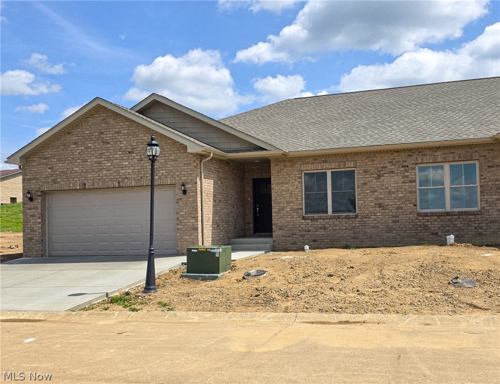Time to relax and enjoy the ease of condo life near all the amenities including Turkana Golf Course.  On the exterior, the condo is bricked on all four sides and will have concrete patios in the rear.  As you walk inside, you'll notice the 9' ceilings with the open concept.  The ceilings are vaulted over the great room and master bedroom areas.  The kitchen has granite counter tops, Delta faucets, solid wood cabinets with slow close drawers.  Stainless steel stove, dishwasher and microwave are installed.  The large island is perfect for quick meals and cooking projects.  There is an area in front of the Pella patio with "between-the-glass" blinds for a dining table with the doors leading out onto the concrete patio. As you walk through the condo, you'll notice how quiet it is inside. The interior 2x4 walls are insulated to control the sound.  Off of the great room, is the master bedroom suite with a beautifully tiled shower with seat and walk-in closet. Closet organizers to be installed shortly. Off the kitchen, is the utility area with washer/dryer hookups.  The garage is insulated, drywalled, painted with primer and has an insulated door. The Lenox furnace and electric hot water tank are accessible from the garage. The exterior walls are insulated,2x6 walls with Pella Tilt-In windows. The landscaping will be finished to match the other properties with red river rocks.   This condo has access to the clubhouse and pool. The landscaping maintenance and snow removal is included in the HOA. The other half of the condo is nearing completion and will be ready to see also.