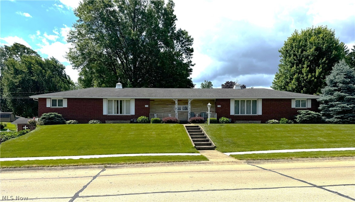 Beautiful well maintained brick duplex on large corner lot. Owners have lived in east side for over 30 years. it has large eat in kitchen, living room, 2 bedrooms and a full bath up, large pantry. This side has a full finished basement that walks out to the side yard. Basement has laundry hook up and a 2nd full bathroom. West side has a tenant who has been living there for over 25 years. This side features large kitchen, living room, 2 bedrooms, full bath and 1st floor laundry. This side has no basement. Concrete drive in rear leads to extra parking and a 2 car garage. Great for owner occupant.