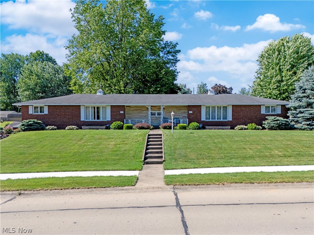 Beautiful well maintained brick duplex on large corner lot. Owners have lived in east side for over 30 years. it has large eat in kitchen, living room, 2 bedrooms and a full bath up, large pantry. This side has a full finished basement that walks out to the side yard. Basement has laundry hook up and a 2nd full bathroom. West side has a tenant who has been living there for over 25 years. This side features large kitchen, living room, 2 bedrooms, full bath and 1st floor laundry. This side has no basement. Concrete drive in rear leads to extra parking and a 2 car garage. Great for owner occupant.