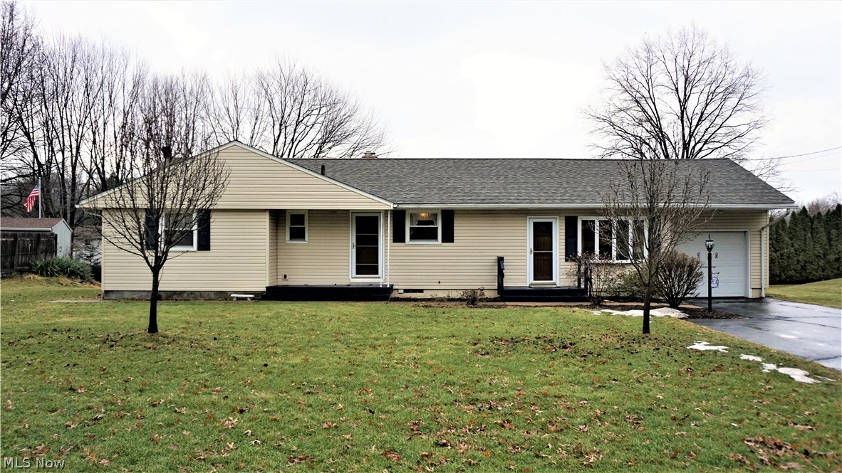 Excellent opportunity in Tallmadge! Walking distance to new middle school and elementary school campus currently under construction. Roof, siding and storm doors replaced in 2012 give the exterior a fresh look. Eat-in kitchen has oak cabinets including a massive cabinet pantry, ample counter space with knee hole perfect for a make-shift office. Arched entry-way leads to a formal space that includes a dining room and family room. Family Room has wood burning fireplace with brick surround, stone hearth and wooden mantle. Picture window over-looks backyard. Off the eat-in kitchen is a large finished breezeway. Breezeway has a beautiful bay window with views of front yard and access to giant Three-Seasons room. Breezeway also has access to the single-car attached garage. Three-Seasons room has new carpet and walls of windows providing plenty of natural light and a door for access to unique covered patio constructed of multi-colored brick pavers. Sleeping quarters include 3 bedrooms and a f