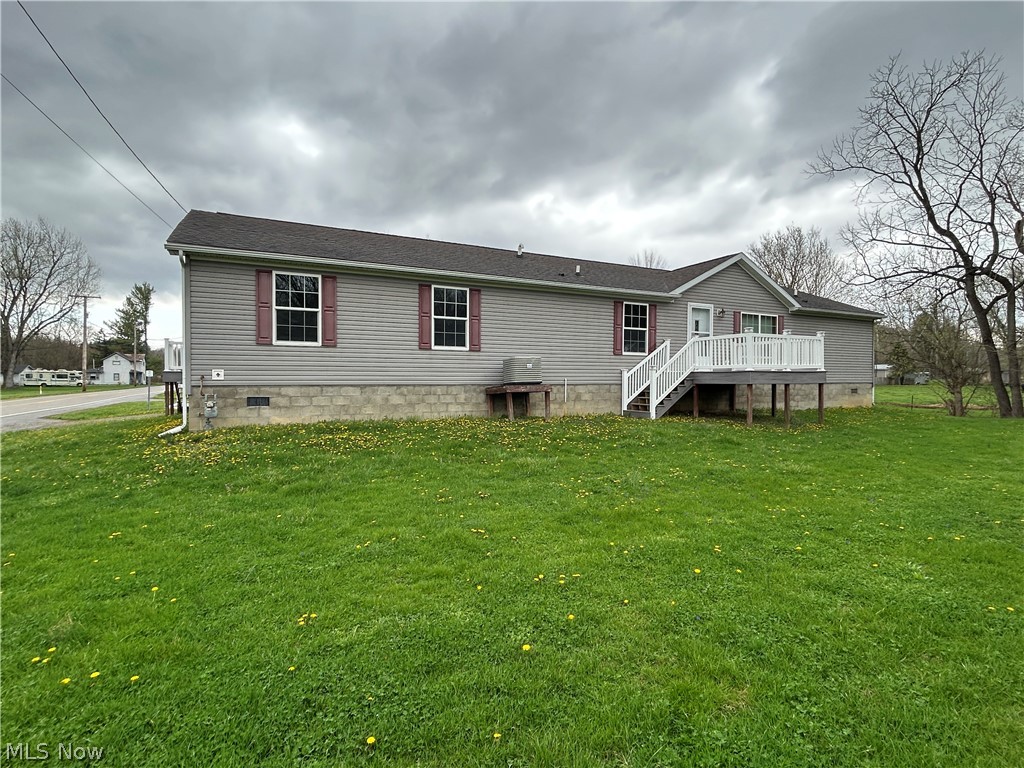 Discover plenty of room for everyone in this 2,160 sq. ft. manufactured home featuring 4 bedrooms and 3 bathrooms. The thoughtfully designed layout offers generous living space suited for families, guests, or those simply looking to spread out and relax. The master bedroom includes an additional space for a home office, sitting room or hobby room. Outside you'll find a 24' x 28' detached garage, perfect for vehicles, storage, or workshop use, along with a 10' x 14' detached building that provides additional flexibility for hobbies, equipment, or extra storage. This property offers an abundant space inside, making it an excellent opportunity for buyers seeking value and potential. Property is being sold as-is with an allowance for flooring upgrades. Mineral rights do not convey with the sale.