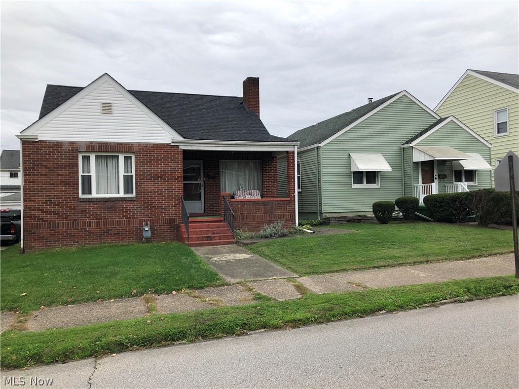 This home has a solid all-brick exterior and features all hardwood floors in the bedrooms, living room and dining room.  A new roof was installed in 2016.  All electrical has been updated recently.  There is a wood fireplace in the living room.  A home warranty up to $500 will be provided to the buyer at closing.  The playground set will remain with the home.