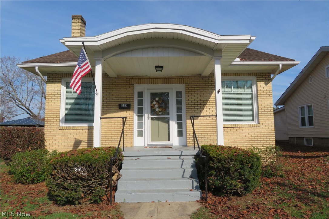 This charming, attractive, roomy brick home has a beautiful Mosaic tile fireplace and a built-in dining room cupboard. The dining room and living room have crown molding to accent and frame the rooms. The living room is very roomy. The covered front porch and the back patio are both great for relaxing.  The kitchen flooring is new this year and complements the numerous white kitchen cabinets. The basement has a bath and a shower plus an additional room. Lots of storage space in this house up and down. The furnace and windows were replaced in 2012. There is  a one car detached garage. This well maintained home is convenient to medical facilities, restaurants, and shopping. Don't miss this wonderful home.