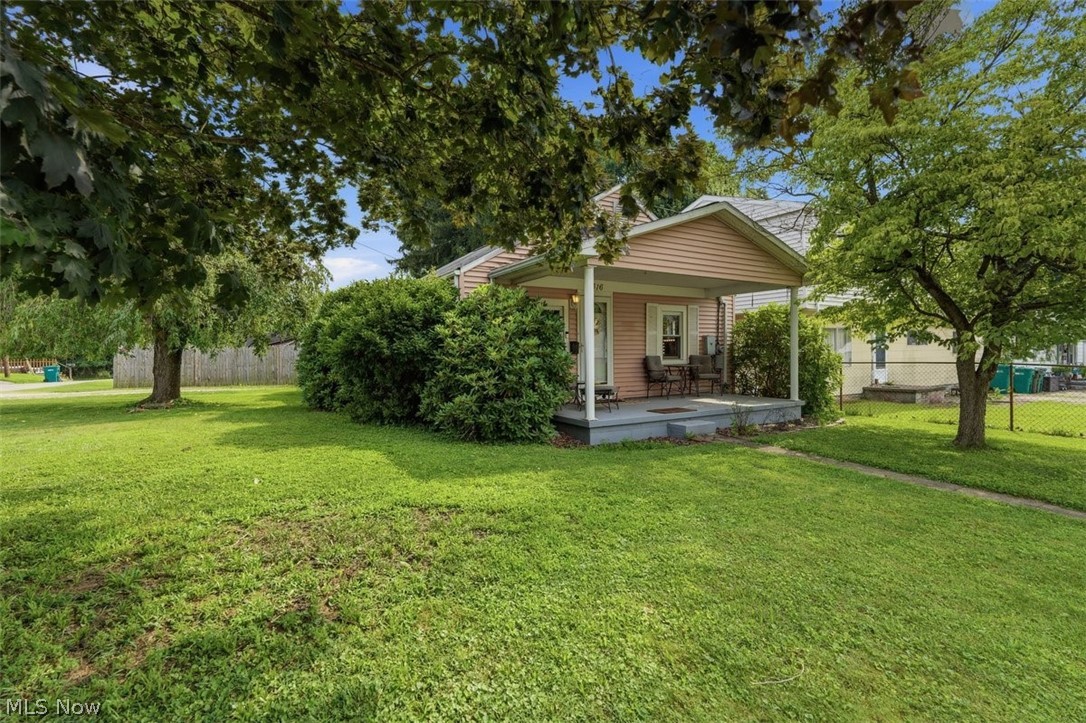 You'll find yourself singing "Ain't That America..." as you pull up to this darling "little Pink House" full of charm & character. The covered front porch invites you into this lovingly cared for 2 bedroom, 1 full bath home with the ease & comfort of all first floor living. Step outside and discover one of the property's standout features...a huge privacy-fenced backyard that's perfect for pets, play, gardening, summer barbecues, or creating your own outdoor retreat. A convenient carport offers covered parking, while the storage shed provides space for tools, lawn equipment, and seasonal items. Recent updates provide peace of mind, including LVP flooring, HVAC system installed in 2024, and a brand NEW ROOF coming soon! Whether you're buying your first place or looking to simplify, this charming HOME is really something to see!