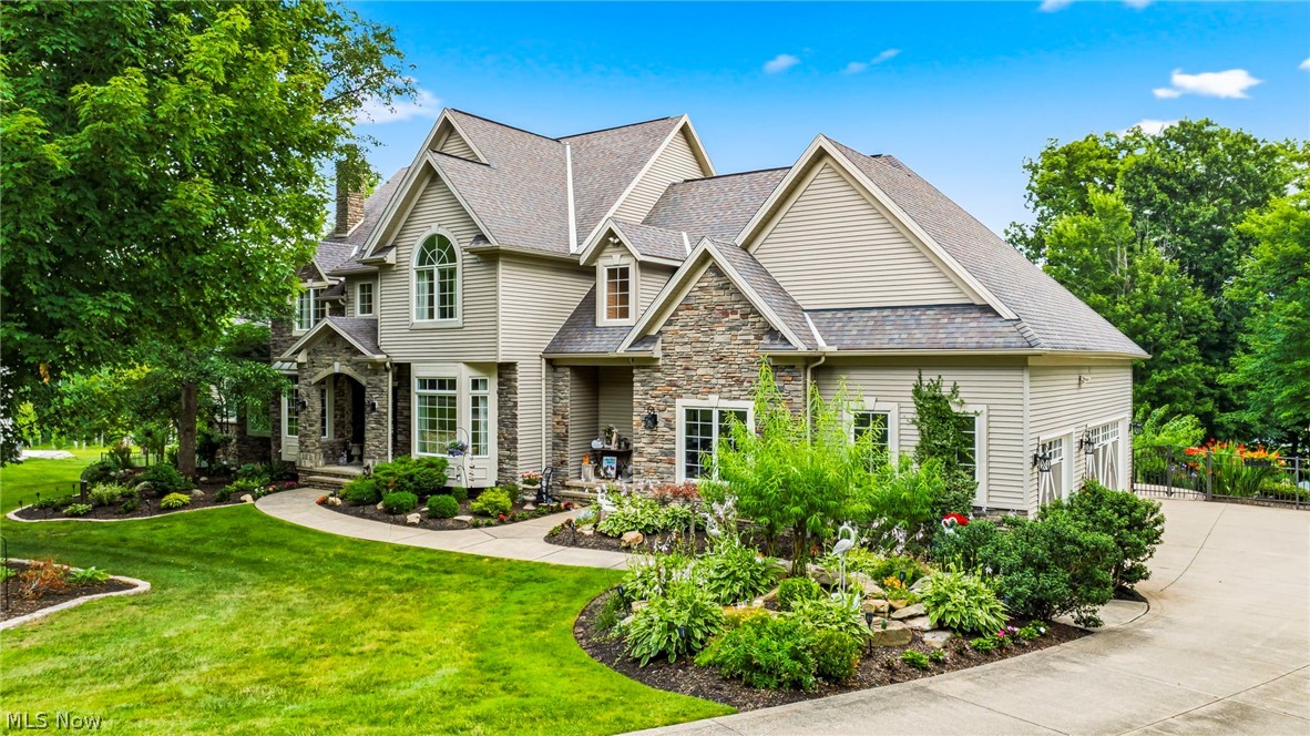 This remarkable estate offers the perfect blend of luxury, comfort, and functionality in an unforgettable setting. Every detail has been thoughtfully designed to create a home that is as impressive for elegant entertaining as it is for everyday living.

Nestled on a breathtaking 4-acre cul-de-sac homesite, this extraordinary French Country estate offers timeless elegance, exceptional craftsmanship, and resort-style outdoor living. Surrounded by professionally designed landscaping with extensive landscape lighting, a scenic pond, and picturesque views, this one-of-a-kind property provides an unmatched lifestyle of luxury and privacy.
From the moment you enter the grand two-story foyer with dual sweeping staircases, you'll appreciate the remarkable attention to detail. The dramatic two-story great room is anchored by a stunning floor-to-ceiling stone fireplace, while the richly appointed wood-paneled library with its own fireplace creates a warm and sophisticated retreat.
The home features a desirable first-floor master suite complete with his and her custom closets and a luxurious en suite bath. 
Designed for the culinary enthusiast, the gourmet kitchen features custom cabinetry, granite countertops, a spacious center island, and a Butler's pantry, seamlessly flowing into the main living and entertaining spaces.
Offering 5 spacious bedrooms and 3½ beautifully appointed bathrooms, this exceptional home provides room for family and guests alike. The walk-out lower level includes a temperature- controlled wine cellar and provides endless possibilities for recreation, entertaining, or additional living space.
The outdoor living spaces are simply spectacular. Enjoy the custom outdoor kitchen and grilling station, expansive 20 X 30 deck with updated surface and railings, gazebo, tranquil pond, and beautifully illuminated grounds enhanced by extensive landscape lighting /creating a magical setting for evening entertaining and peaceful relaxation.