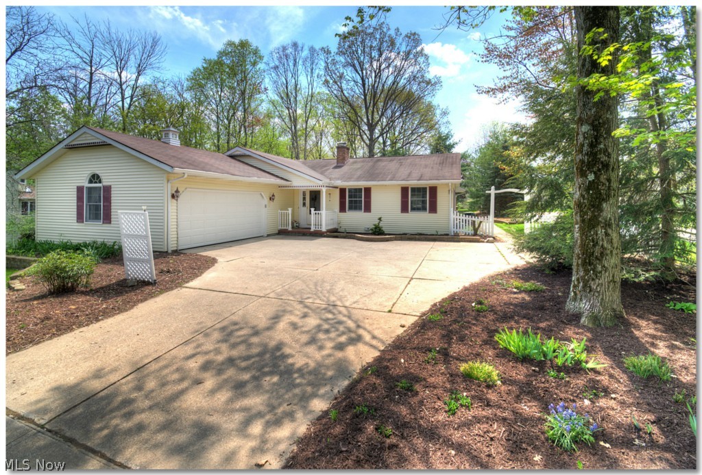 Imagine waking in the morning and having coffee in the Morning Room just off the updated Kitchen & looking out the
windows, past the Sunroom & multiple decks to the wooded backyard*Or, coming home from a hard day at work,
retreating to the Master Suite with the walk-in closet & going outside to your own private deck, going into the hot tub
gazebo & just relaxing, watching the birds in the trees & hearing the gentle trickle of the stream down the ravine*
Friends are coming over and you have lit the gas logs in the brick fireplace in the living room*The hardwood floors are
shining & the table in the dining room is set*Door is open to the Sunroom & the doors are open to the deck*You are so
glad the Pergola adds some shade*Perhaps someone will want to take a dip in the pool?The chairs are set on the deck
overlooking the pond*And, yes, you did remember to put the lawn tractor in the shed*The children love playing in the
playhouse built into the walk-out basement*That 4th bedroom in the lower level makes the perfect office & with the
Futon, it's great for a Guest Room*Maybe we'll finish the rest of the walk-out lower level next year*There is that builtin
workbench...