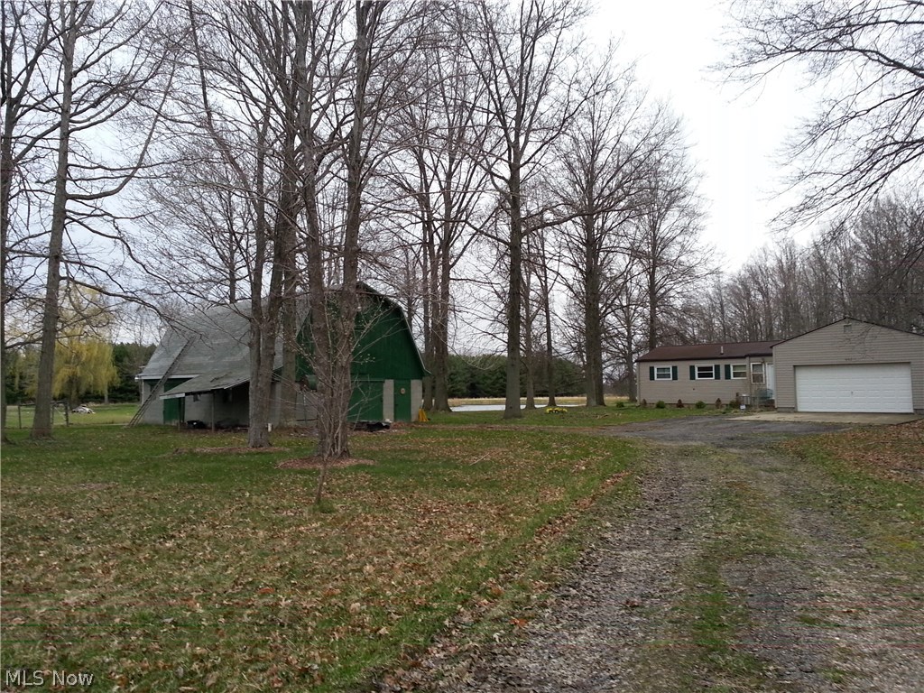 8 Acres.  Pond.  Private location - sits back approximately 450' off the road.  Fenced pasture.  Two Story Barn currently has 2-Stalls with room to add more.  Ranch home with 2 finished bedrooms and 1 unfinished.  Remodeled kitchen and bath.  Some finish work still being done.  Hickory cabinets- Large kitchen.  Septic is Leach field and tested by TCHD.