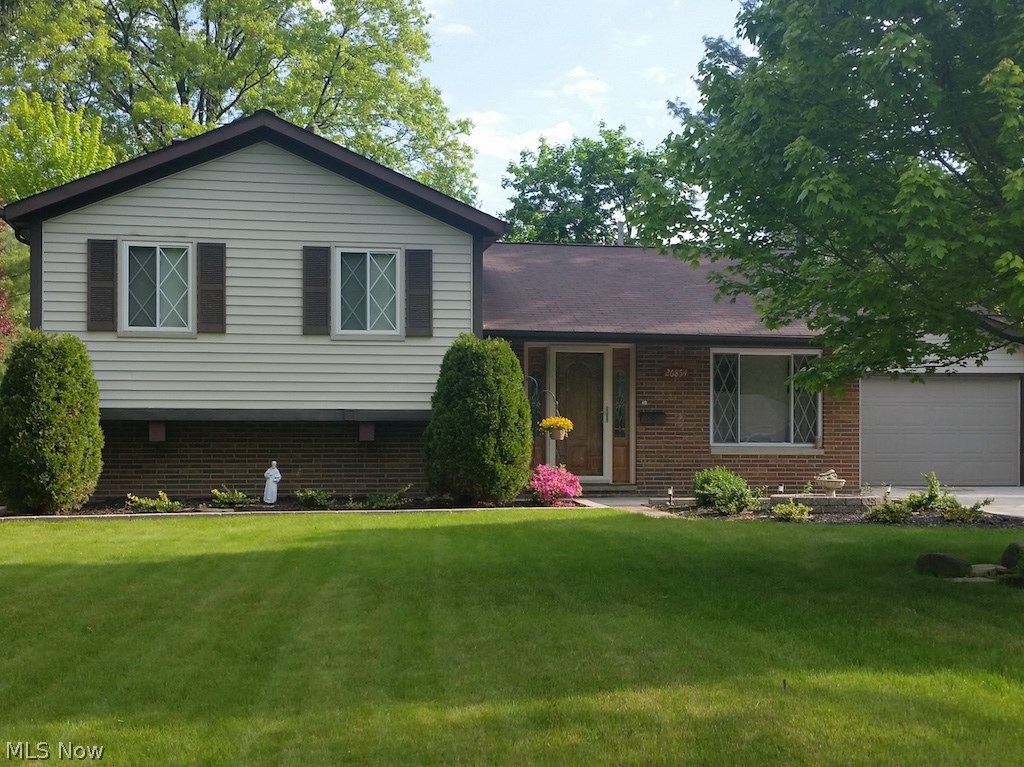 Entertainers delight.  This updated 3 bedroom split level includes a covered outdoor bar, concrete patio, wood deck and firepit for entertaining and fun. The spacious living room has a wood burning fireplace. The family room is cozy for easy living. The bathrooms are updated. New concrete driveway, patio, walkways and landscaping in 2015. The Utility/Laundry Room has a NatureStone® floor - Washer and Dryer included. The storage shed is vinyl sided to match, has electricity and is built on a concrete slab. The Kitchen appliances, outdoor barstools, outdoor TV, garage fridge and more are included.  The 2 car garage has additional built in storage closets.

Pretty on the outside, gorgeous on the inside.  Move-in ready.  Call today for an appointment to tour this home.