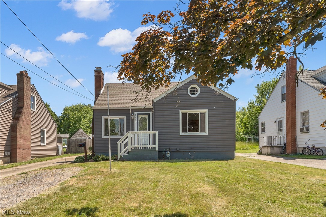 Charming Cape Cod in Boardman offering 3-4 bedrooms and 2 full baths! This Boardman home welcomes you into a warm living room with hardwood floors, a cozy brick fireplace, and built-in bookshelves. Formal dining room features stylish two-tone walls and a large window overlooking the yard. Updated eat-in kitchen boasts white cabinetry, appliances that stay and tile flooring. Spacious bedroom with wood floors and ceiling fan,  plus a bonus finished attic space with knotty pine walls and built-in storage—perfect for a playroom or office. Enjoy the outdoors on the back deck overlooking the backyard. Full basement (partially finished) with sump pump, forced air gas heat, central air, detached 1-car garage, and public water/sewer. Move-in ready and full of character—schedule your showing today!