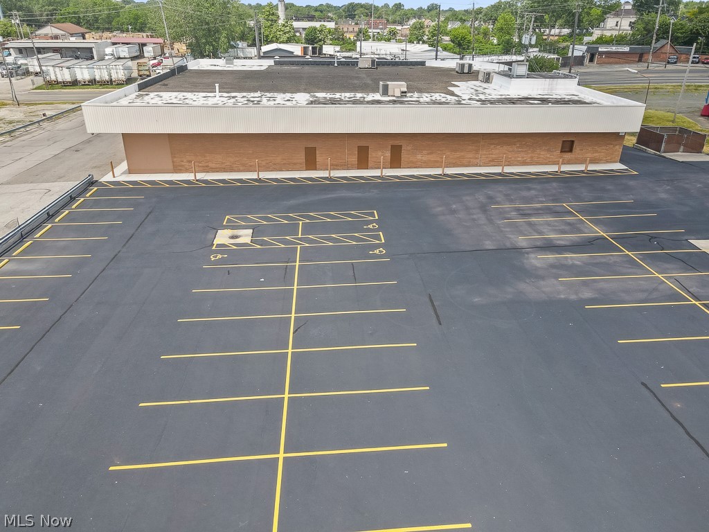 Prime commercial opportunity on highly traveled Ridge Rd in Cleveland’s west side corridor. This property offers exceptional visibility and consistent traffic exposure—ideal for a variety of business uses including retail, office, warehouse or service-based operations.  The building features a flexible and open interior layout that can be adapted to suit multiple business needs, with ample space for customer-facing areas, offices, or workspace. Large on-site parking adds convenience for both clients and staff.  Conveniently located near major highways including I-480 and I-71, and surrounded by established businesses, residential neighborhoods, and daily traffic generators. Whether you’re an owner-user looking to establish your presence or an investor seeking a well-positioned asset, this property presents strong potential.
