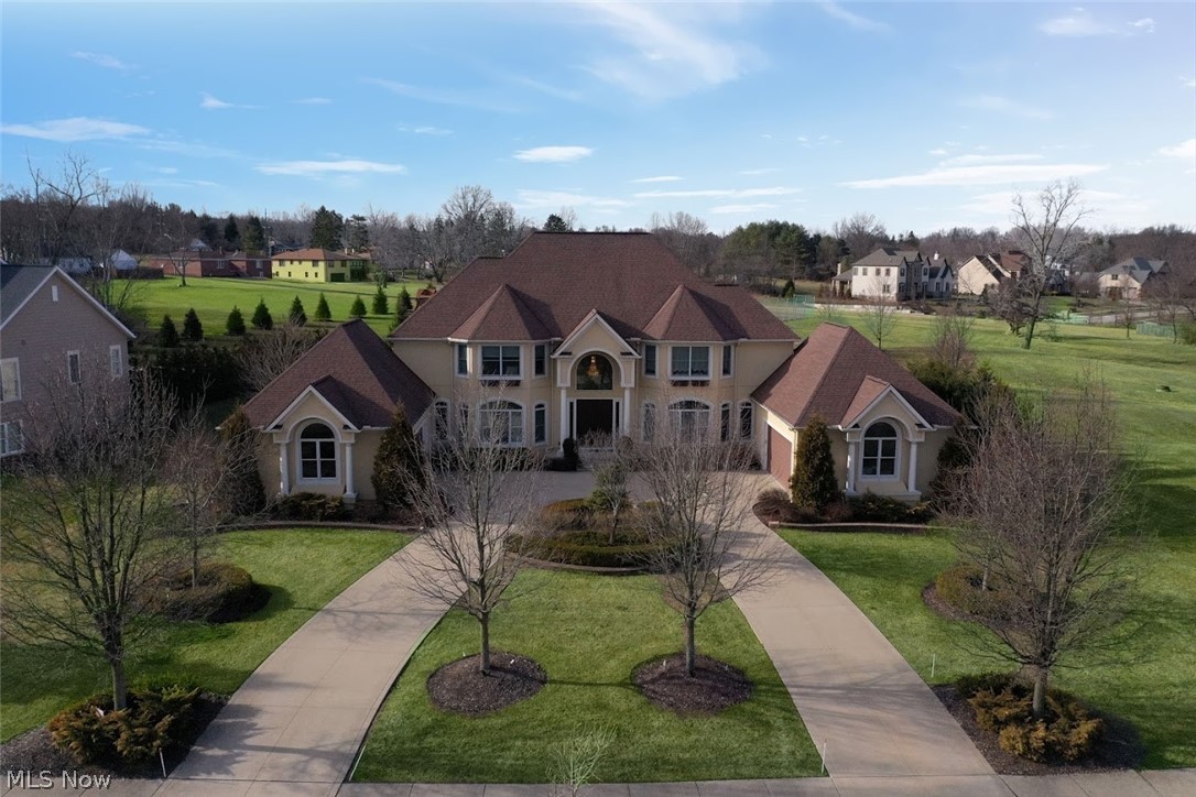 An indulgent, pampered lifestyle and an aesthetic of timeless beauty are yours at 6749 Rivercrest Drive within the quaint town of Brecksville.  Boldly espousing grand Tuscan Architecture, the incontestable curb appeal of this captivating, one-owner custom home is only rivaled by its eye-candy and highly practical interior appointments. Elevate your standard of living with a myriad of amenities, including, but not limited to: accommodations for four cars; dramatic vaulted entry with Schonbek Lighting and curved staircase; an epicurean kitchen that exudes culinary ecstasy and ensures high performance and indulgence at every angle; a private first floor guest suite; expansive, inviting and sun-drenched common areas; a cavernous, beautifully finished lower level with fully-applianced kitchen and theatre / gym accommodations, oversized family room and full bathroom; three laundry rooms (the first adjoining an oversized bath to transition into the home free of work clothes) and so much more!