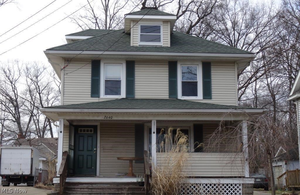 Cuyahoga Falls colonial, great location! Appears to have some larger updates including roof, electric, furnace, HWT, windows, patio door. Wood burning fireplace and hardwood floors.  Needs some TLC, restore this beautiful home!