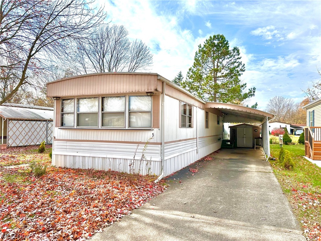 COLUMBIA PARK IS A 55 YEAR AND OLDER CONCEPT OF LIVING and is Ohio's Premiere Adult Land Lease Community! Amenities include: Gatehouse managed entrance, on site Shopping Plaza, on site Management, walking path/dog walking path, shuffleboard, bocce ball, library, crafts, and a social hall! WELCOME HOME this 2 bedroom, 1 bath, 980 sqft home is COMPLETELY RENOVATED! In the kitchen you will find new cabinets, a new sink & fixture, new shelves and new butcher block counters. Completely remodeled bathroom with walk-in shower and floor to ceiling tile, with a new vessel sink & fixture. New LVP floors throughout, and BRAND NEW mini-splits.  This is home boasts a huge open concept kitchen and living room, plus tons of storage of utility space. There is a huge patio which offers an additional 200 sqft of living space plus a carport with shed to keep your vehicle and outdoor items out of the elements. This home is in PHENOMENAL condition and being sold as-is. This home is priced to sell fast, schedule a tour before it's gone!
