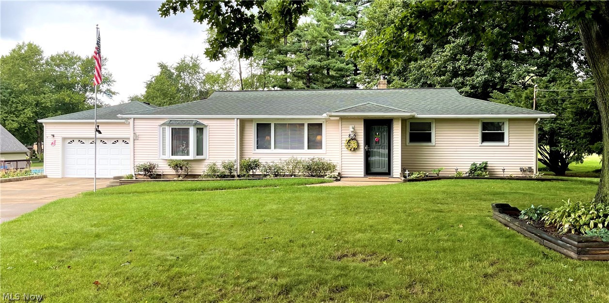 Welcome Home! Just off the beaten path, tucked away in a quiet neighborhood surrounded by trees, hides this beautiful home on over a half an acre of yard. This home has been cared for and it shows! It has an extra long double drive with a two car garage. The large front yard has boxed flower beds through out and along the sides of the drive. Upon entering, you will notice the gorgeous hard wood floors leading into the home. The living room has built in cabinets and over sized windows to brighten the space. The living room flows into the kitchen with an open concept. The kitchen is a cooks dream with recessed lighting, custom decorative cabinets, and countertop spaces every direction you turn! To The left is the master bedroom and master bathroom. This bedroom is impressive (20'x13.5') and features beautiful wooden closet doors with an inlaid mirror and a bay window! The master bath is tastefully done in white and features a large walk-in shower with double seats and inlays. To the righ