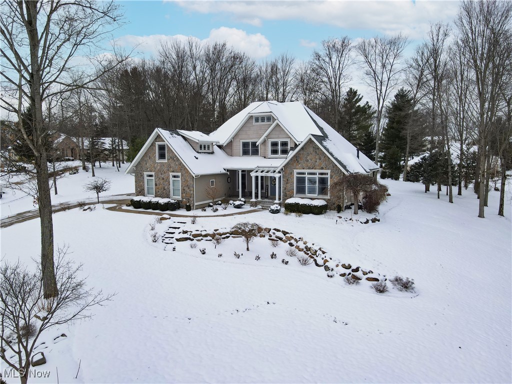 Previous Parade of Homes Award–winner in the highly desirable Lake Royale community! This impressive custom built residence has been meticulously maintained & improved and features an open floor plan with spaciousness, functionality, vaulted ceilings, an abundance of light with the amazing windows & many special features. The dramatic two-story great room w/ fireplace flows into the dining area, creating a welcoming space for meals & entertaining.  Huge eat-in kitchen is a true centerpiece, offering plenty of cabinets, pantry, granite counters, large 4' x 8' island with prep sink, Newer top of the line appliances (Bosch Refrigerator, dishwaster, double ovens with one being a convection oven & Bosch range hood (2021, 2024 & 2026), and second prep sink with disposal. The eating area/sunroom will lead you through the sliders to the private backyard where you will find a concrete patio & firepit.  The first-floor primary suite offers a retreat with its own fireplace and beautiful bath featuring updated walk-in shower jetted tub, 2 walk in closets and double vanities.  A convenient laundry and half bath complete the first floor.  You will find 3 bedrooms, 2 full baths & stylish loft - perfect for an office or reading nook - on the 2nd floor (in fact..one of the bedrooms has it's own full bath).    Completed in 2021, the fantastic finished lower level adds exceptional versatility with it's large recreation room, bar, built-in beverage refrigerator, half bath, sewing room or office, and a hidden door leading to a private exercise room. Notable updates include new roof with 50-year shingles, blown-in insulation & carpeting (2024), AC, humidifier, water softener, water filtration system, 3 M Solar on windows (2021); whole-house generator (2020).  The 3 car heated climate control garage, incredible hardscape, exterior lighting and landscaping, Weber gas grill and irrigation system are a few of the other special features.  This home will absolutely "WOW" you!