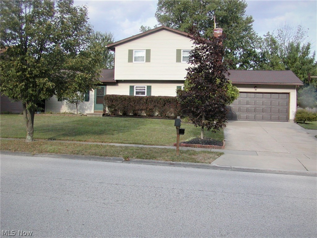 Lot:  90 X 150.  Lake privileges available. Enjoy life by living in this roomy 4 bedroom 2 1/2 bath well maintained  home in Wyoga Lake Estates.  Applianced  kitchen plus formal dining room with sliding doors to three season room to privacy fenced patio and sitting area. Great for a hot tub that stays but needs a pump & new cover.  A gate leads to a large lot. 2 car garage with an extra  8' X 14' added to the back, Ceiling fans in many rooms. Updates include --Furnace--2014, Central air--2014, Hot water tank--2015, Tilt-in windows for easy cleaning--2008, Laminate flooring in most rooms. Master bedroom with private bath, wood burning fireplace in the family room. Cement crawl space under the house with loads of storage, first floor laundry. Lot in back goes to the large trees. America's Preferred Home Warranty included.