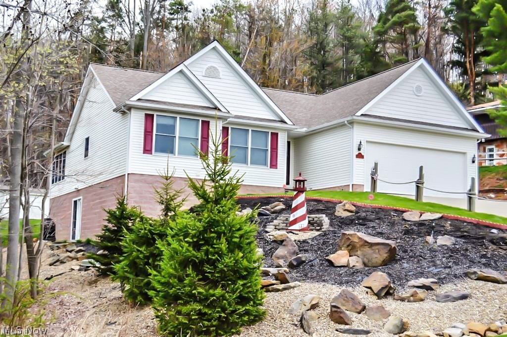 Welcome to Lake Living at it's best! This beautiful home on lake Mohawk is waiting for you. The brand new kitchen has the latest cabinetry, plus a new back splash, quartz counters and new appliances that remain with the home. All fresh wood flooring on the first floor of this ranch ties it all together and brings a updated cohesive feel to the space. Enjoy water views from the front windows to relax and read while watching the calm water. The finished walk out basement has a huge bar with sink and mini fridge and the outside has a gorgeous patio, installed in fall of 2018 with a new fire pit, so have parties or hang out inside or out. The fenced back yard will keep your furry friends contained without worry. You will not want to miss this lovely home on the lake.