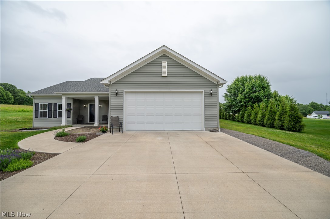East Palestine, OH - Why build when you could become the second owner of this thoughtfully designed ranch style home boasting 3 bedrooms and 2 full baths. Built in 2020, this slightly over 1600 square foot home is located at the end of a quiet cul-de-sac within the village of East Palestine.  The primary suite is privately situated on one side of the home while the other 2 bedrooms and guest bath are located on the opposite side of the home. Once you enter the expansive great room your eyes will focus on the fireplace which can be seen from the entry, dining area, the great room and the eat in kitchen. The first-floor laundry, situated directly off the kitchen, offers exceptional convenience and streamlines everyday living. This home offers upgrades including: granite countertops, stainless appliances, quartz vanity tops, oversized garage with 8 foot door built to provide plenty of space for a quad-cab pickup truck. This well-maintained home shows exceptionally well and with an acceptable offer, the seller has agreed to purchase a home warranty for the buyer adding extra layer to peace of mind. East Palestine is located on the OH/PA state line and is approximately 25 minutes from Youngstown, OH, 1 hour from Pittsburgh, PA, 40 minutes from the Pittsburgh International Airport and 1.5 hours from Cleveland, OH.