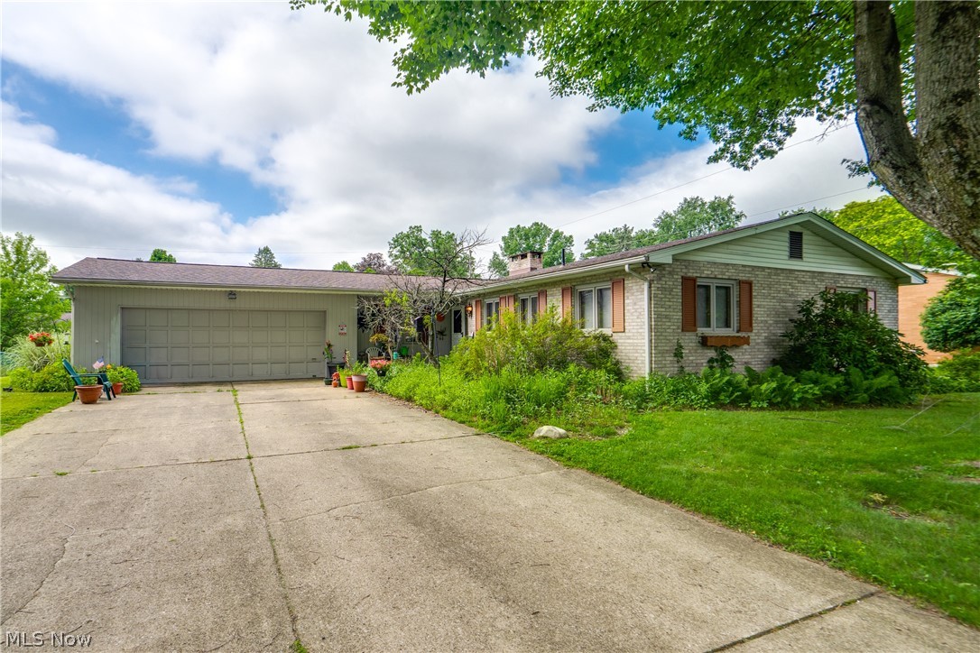 Spacious & Versatile Home with Abundant Garage Space and Storage Throughout! Nestled in a quiet neighborhood in Plain LSD, it's conveniently located near Cleveland Avenue, parks, and major highways. Step into the welcoming entryway, which features double closets for ample storage. The main floor flows naturally between the generously sized kitchen and the adjoining dining/living room , making it ideal for entertaining. The kitchen features a pantry with attic access, and a sliding glass door — with newer slider glass — leading to the patio. The living/dining area boasts beautiful wood ceiling beams, wood paneling, and direct access to both the garage and backyard. A warm, inviting family room anchors the home with a brick-surrounded fireplace, a wall mural, and large windows that bathe the space in sunlight and overlook the backyard. Rich wood trim runs throughout the entire main floor, adding character and charm. The home offers three bedrooms, including a master suite with its own full bath featuring a walk-in shower and plenty of closet space. The two additional bedrooms each include double closet doors. A full hall bath with built-in shelving and a tub completes the main level. The partially finished basement adds significant living and utility space. A large rec room provides an open, flexible area for recreation or hobbies, and a full bath with a walk-in shower, and a single vanity offers added convenience. Outside, you'll love the garage space this home provides! At the front of the home, you'll find a two-car garage space, and on the side, you'll find additional garage space that could fit a potential of 3-4 cars. Out back is a patio that overlooks the backyard. Don't miss your chance to see this wonderful home; schedule your showing today!