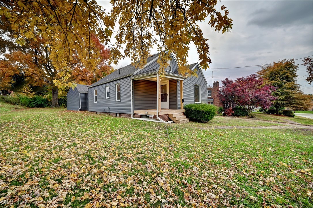 Welcome to this charming, remodeled four bedrooms and one full bath home that has been freshly painted and all new flooring throughout (2024). Come on up the front covered porch that was newly redone leading to the living room that offers a large picturesque window to let the natural light to shine through, dining room/bonus room and kitchen. The large, modern bright, eat in kitchen offers abundant of cabinets, double sink, and ceiling fan. Two bedrooms on the main floor.with an updated full bathroom. Upstairs you have two more bedrooms. Large, clean unfinished basement is great for storage, work out area, laundry area, etc. New vinyl siding (2024),  and vinyl windows, hot water tank (2021), roof is ten years young. There is a fabulous mud room/breezeway to the spacious two car garage with a loft area that is great for more storage, etc. Large backyard for entertaining or relaxing. Close to Canton and Plain Local Schools. All you have to do is move right in!