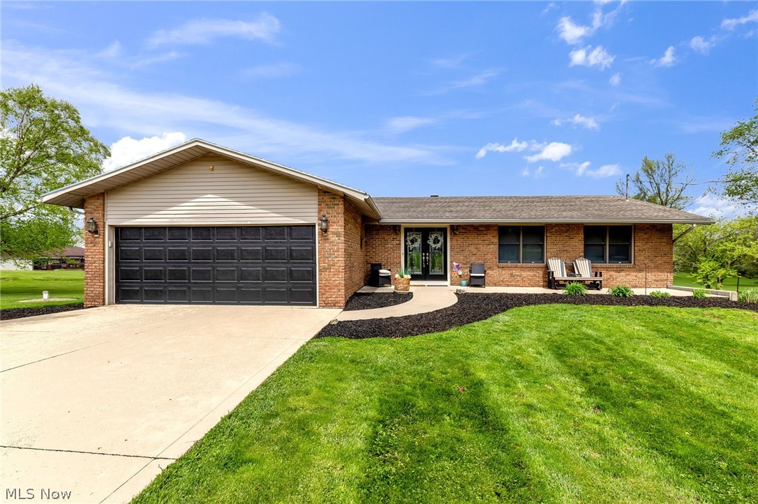 Beautifully updated, 3 bedroom, 3 full bathroom brick ranch on 1.7942 acres in Ontario Local Schools. Many updates throughout including a gorgeous new kitchen in 2020 featuring quartz countertops, soft close cabinets, and tons of cabinet space including a pantry. Open concept kitchen, dining area, and living room with sliding doors to the huge back deck, offering plenty of room for indoor or outdoor gatherings.  Main floor primary bedroom with en suite bathroom and sliding doors to the deck. The huge, recently remodeled walkout lower level offers tons of additional living space, with a family room with wood burning fireplace, rec room / playroom, full bathroom and laundry room, and plenty of storage space. Enjoy summertime in the above ground pool with a new pool deck in 2024 or relaxing and enjoying the beautiful backyard views from the updated patio (2025).  Other updates include new flooring throughout the home (2020) and new retaining wall (2025).  You will love this home - schedule your showing today!