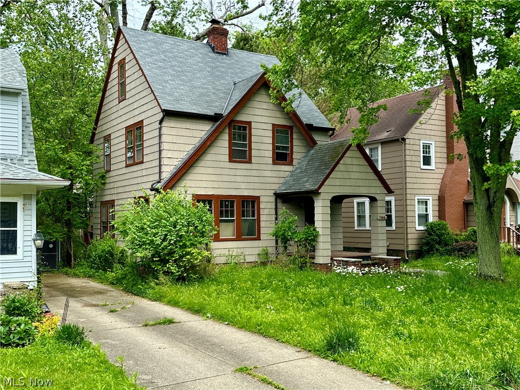 Classic Cleveland Heights colonial-inspired home with architectural character, meaningful renovation progress already underway, and strong long-term upside potential. Situated in a desirable Cleveland Heights location, this 3-bedroom property features hardwood flooring, fireplace, detached 2-car garage, rear deck with second-story balcony, and a layout that blends original charm with an increasingly open and modernized feel. The home retains many original character elements while also reflecting renovation work already started, including an opened kitchen/dining configuration that creates a more connected main living space than many homes of this era. Large windows, natural light, original wood flooring, flexible room flow, and a full walk-up attic create a strong foundation for restoration and repositioning. Property will require repairs, updates, and completion of ongoing renovation work. Ideal for investors, rehabbers, restoration-minded buyers, or buyers seeking a project with long-term upside in a recognizable east-side Cleveland Heights location. Property being sold as-is.