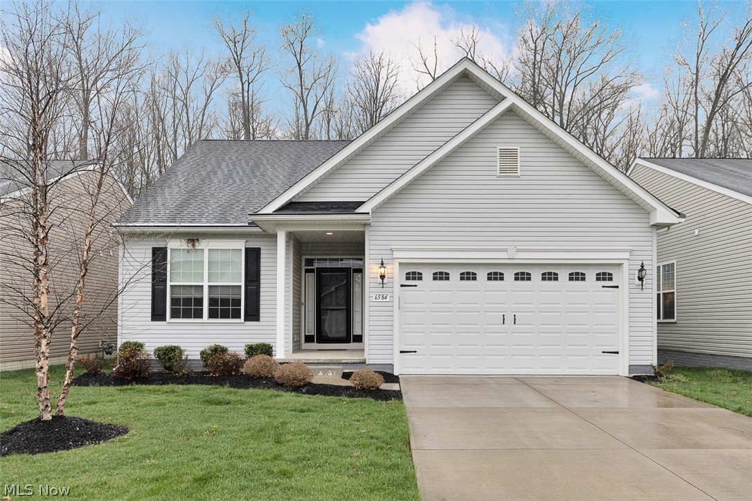 Welcome to your dream home in the heart of North Ridgeville’s sought-after Meadow Lake subdivision! This impeccable three-bedroom residence is not just a house; it’s a lifestyle waiting to be embraced. As you step onto the cozy covered front porch, you’ll immediately feel the warmth and charm that this home exudes. Step inside to discover a bright and airy open-concept design that perfectly blends style and function. The heart of the home features a stunning kitchen equipped with beautiful granite countertops, a central breakfast island, and sleek stainless steel appliances. With a large pantry at your disposal, meal prep and entertaining will be a breeze. The spacious great room invites you to relax in comfort, bathed in natural light streaming through the sliding glass door that leads to the picturesque backyard. Imagine hosting gatherings or enjoying quiet evenings in this inviting space, where every moment feels special. Retreat to the generously sized primary suite, which boasts a large walk-in closet and a luxurious ensuite bathroom. Indulge in self-care with dual sinks, a walk-in shower, and a separate commode area, ensuring your personal oasis remains both functional and elegant.The lower level is a blank canvas, ready for your creative touch—transform it into a game room, home gym, or extra storage space; the possibilities are endless! For those who love outdoor living, the covered screened-in patio is the perfect spot for morning coffee or a peaceful afternoon spent reading. To give you peace of mind, a home warranty is included, allowing you to focus on making beautiful memories in your new sanctuary. Don’t let this opportunity slip away—call today for your private tour and step into a home that truly has it all! Your vibrant, fulfilling lifestyle awaits!