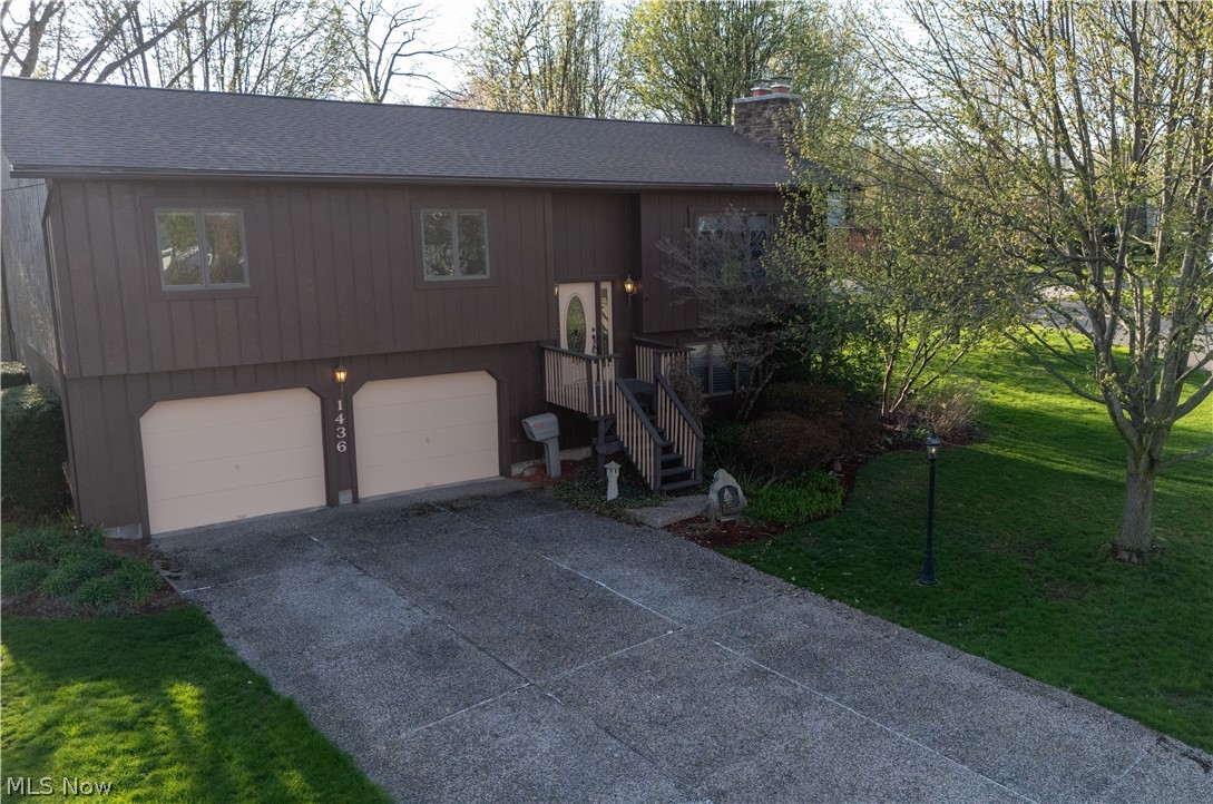 Welcome home to the West Side! Tucked away in one of Barberton’s most peaceful, established neighborhoods, this charming three-bedroom, two-bath bi-level is ready for its next chapter. This home has been loved by the same family since the day it was built, and you can feel that care the moment you walk through the door.
We’ve taken care of the big things so you don’t have to. It is fresh and modern with brand new carpet (2026) and refreshed flooring and countertops in the kitchen and baths. It gives peace of mind as it boasts a total roof replacement and a cozy new wood-burning fireplace (both 2025). And it is low maintenance as the exterior of the home features a fresh coat of Rhinoshield (2025) designed to look great for years, plus a high-efficiency heat pump and a massive 80-gallon hot water tank to keep utility bills low and showers warm.
Spend your spring mornings on the private back deck overlooking the lush, mature landscaping. Between the spacious two-car garage and the sturdy Amish-built shed, you’ll never run out of room for hobbies or storage. This is a clean, smoke-free, truly move-in-ready space. Come see why this house has been so cherished for decades—your family might just be the next to fall in love!