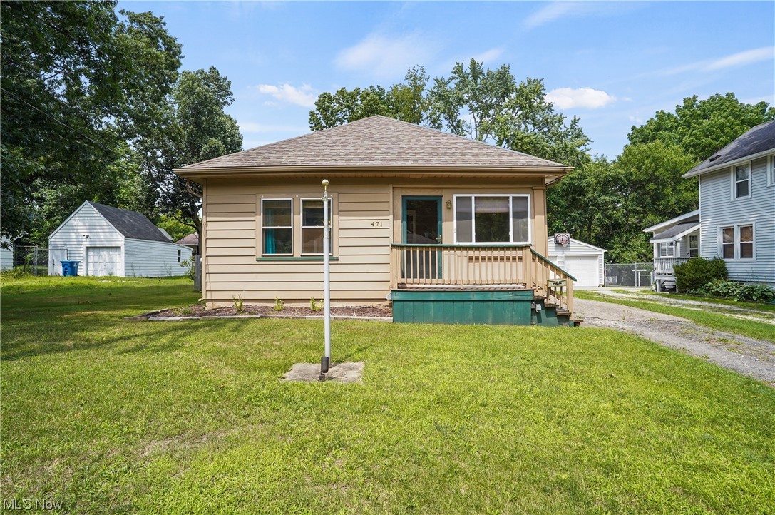 471 Stinaff St Kent, OH 44240 is a gorgeous fully remodeled RANCH home with front sunroom entry & rear mudroom entry, fully fenced in backyard w/ 6ft privacy fence & 2 gates installed in 2017. New roof installed home & garage in 2016 followed up w/ bathroom remodel ceramic porcelain tile, new shower bath full surround, LED lighting w/ touch control on mirror, new vanity, elongated commode, awesome flooring & deco paint w/ accents, are just some of the highlights. New high efficient furnace added in 2018; older but goodie central air conditioning system. 2021 remodel of kitchen included quartz countertops, luxury vinyl tile, SS sink, faucet, painted cabinets, new hardware, new vent for stove which, like all updated kitchen appliances are stainless steel about 5 years old.  Electric panel installed, enclosed sunroom & mudroom added along w/ GFCIs, plumbing, Sewer lines. LVT flooring installed throughout entire living spaces including bedrooms, hall & dining room, living room & entire int