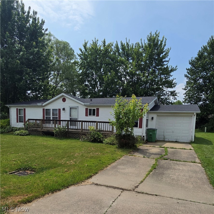 Welcome home to this beautiful, 3-bedroom, 2-full-bath manufactured home located in the highly desirable Austin Woods Community in Geneva, Ohio. Step inside to an open-concept living area featuring abundant natural light and a spacious floor plan perfect for both relaxing and entertaining. The modern kitchen boasts ample cabinet space, , and a convenient breakfast bar that overlooks the generous dining and living spaces. Unwind in the private primary bedroom suite, complete with its own large walk-in closet and an attached full bathroom. Two additional spacious bedrooms provide plenty of room for family, guests, or a dedicated home office, and share easy access to a second full bath. Situated on a double lot with a large backyard, this home offers quiet, maintenance-free community living just minutes away from historic downtown Geneva, local parks, shopping, and the beautiful Lake Erie Shoreline!