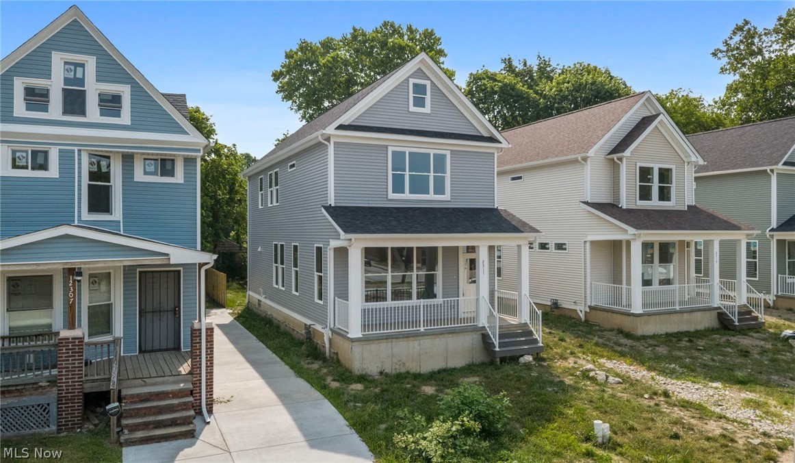 Your dream home is almost complete! Eligible for a 15-year tax abatement, this stunning new construction offers exceptional value and the perfect combination of modern living and unbeatable convenience. Perfectly located in the heart of Fairfax, you'll be just minutes from Cleveland Clinic Main Campus, University Hospitals Main Campus, Case Western Reserve University, the Cleveland Museum of Art, Cleveland Botanical Garden, and many of the city's premier cultural attractions, dining, and entertainment. A charming covered front porch welcomes you home and provides the perfect spot to enjoy your morning coffee. Step inside to a bright, open-concept main level featuring soaring ceilings, abundant natural light, and a spacious layout designed for both everyday living and entertaining. The beautifully appointed kitchen showcases white shaker cabinetry, quartz countertops, a large center island with seating, and ample cabinet and counter space, seamlessly flowing into the dining and living areas. A convenient half bath completes the main level. Upstairs, the spacious owner's suite is a true retreat, featuring a vaulted ceiling, a walk-in closet, and a beautifully designed ensuite bath with a dual-sink vanity offering plenty of storage, a tiled walk-in shower, and a frameless glass door. Two additional generously sized bedrooms, a full bath, and a convenient second-floor laundry room complete the upper level. The full unfinished basement offers endless possibilities to create additional living space, a home gym, recreation room, or extra storage to suit your needs. A detached two-car garage completes this exceptional home. Don't miss this incredible opportunity to own a beautiful brand-new home in one of Cleveland's most convenient and rapidly growing neighborhoods while enjoying the benefits of a 15-year tax abatement!