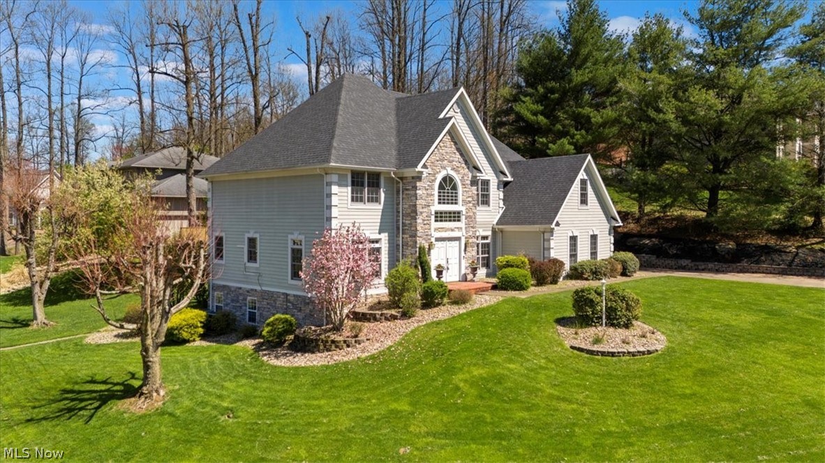 Welcome to Glenbrook and this impressive Vienna residence, gracefully positioned on a beautiful corner lot offering more than half an acre of manicured grounds. With over 4,600 square feet of living space, 5 bedrooms, and 4.5 baths, this home delivers the space, comfort, and elegance today’s buyers are searching for. From the moment you step inside, the grand foyer and sweeping staircase create a striking first impression and set the tone for the refined spaces found throughout the home. The spacious kitchen is both functional and inviting, featuring a center island with seating, abundant cabinetry, generous counter space, and a charming breakfast area. Natural light fills the space, while direct access to the screened patio creates the perfect setting for relaxed moments overlooking the backyard. The primary suite is truly expansive, offering a private retreat complete with a walk-in closet, ensuite bath, and an attached nursery or flex space ideal for a sitting room, home office, or dressing area. The walk-out lower level adds remarkable versatility with a private in-law suite featuring a kitchenette, fireside family room, full bath, bedroom, and an additional bonus room that can easily adapt to your lifestyle needs. Step outside to enjoy the spacious rear deck and lush lawn, perfect for entertaining or simply enjoying the peaceful surroundings. A three-stall garage provides ample room for vehicles, storage, or hobbies.  With exceptional square footage, thoughtful design, and a highly desirable Vienna location, this beautiful home presents a rare opportunity and is priced below appraised value.