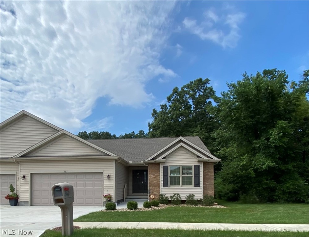 This beautiful 2 bedroom, 2 bath condo is situated on a private lot overlooking a wooded backyard. Just 3 years old, this unit was built with the highest quality and craftsmanship. From the wide plank hardwood floors throughout to the granite countertops and everything in between, this home will exceed all of your expectations! With a terrific open layout that lends itself to entertaining, the spacious great room offers cathedral ceilings and beautiful gas fireplace with floor-to-ceiling stone. The kitchen has white cabinetry, granite countertops, breakfast bar, and large eating area. The master bedroom suite features a large walk in closet, gorgeous bathroom with dual sinks and a custom walk-in shower. An additional bedroom and a full bath finish out the main level. Other highlights include covered front & back porches, full basement with bath rough-in, and attached two car garage.