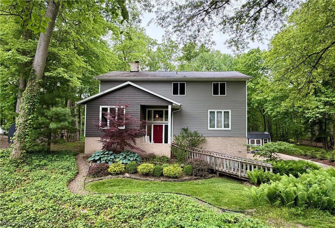 Discover this one-of-a-kind contemporary Colonial tucked away on a private .53-acre property in Strongsville’s sought-after Co-Moor community. A nature lover’s dream, this home combines serene surroundings with an abundance of living space with over 4,200 square feet of thoughtfully designed rooms for everyday comfort and entertaining. Step inside to a welcoming living room featuring a cozy fireplace and impressive patio doors framing views of the picturesque backyard. A formal dining room opens to a spacious kitchen with generous cabinetry, ample prep space, a pantry, coffee bar, included appliances, updated flooring, and a bright dining area with a sliding door to the sprawling deck, perfect for outdoor gatherings or peaceful mornings. Adding to the homes appeal there ae multiple spaces for the whole family to enjoy including the comfortable family room, a versatile game room, a workshop off the oversized 3 car garage, and a bonus room off the primary suite, an ideal space for an office, nursery, or craft room. Two half baths ideal for guests & a large laundry room. Upstairs, four bedrooms & two full baths offer room for everyone. The park-like backyard invites relaxation with its firepit area and storage shed, an inviting spot for cool autumn evenings spent roasting marshmallows with family and friends. Updates include new siding (2017), gutters (2018), deck (2018), shed (2021), and a new furnace and A/C (2025). Enjoy all that Co-Moor has to offer, from its community pool and recreational amenities to its convenient location near schools, shopping, restaurants, quick interstate access and Strongsville’s beautiful Metroparks. This property blends privacy, space, and an active neighborhood lifestyle, making it a truly special place to call home.