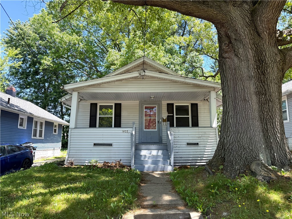 Investor opportunity with immediate cash flow! This well-maintained rental property is currently occupied and generating $1,091 per month, with the tenant responsible for all utilities. Inside, you'll find updated flooring and carpet throughout, an updated kitchen, and a refreshed bathroom, creating an attractive and comfortable living space for tenants. The property includes vinyl windows throughout for added efficiency and low maintenance.

Outside, the home features a covered front porch, a fenced-in backyard, and a 1-car detached garage, offering desirable amenities that help support long-term tenant satisfaction. Whether you're looking to expand your investment portfolio or add a turnkey income-producing property to your holdings, this property offers strong rental income and solid value from day one.