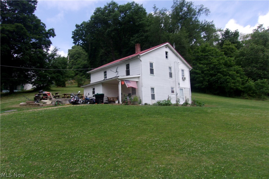 2 story frame sided with metal roof. with 4 lots that's .66 of an acre. Garage on .63 acre. House rented for $750.0 per month.