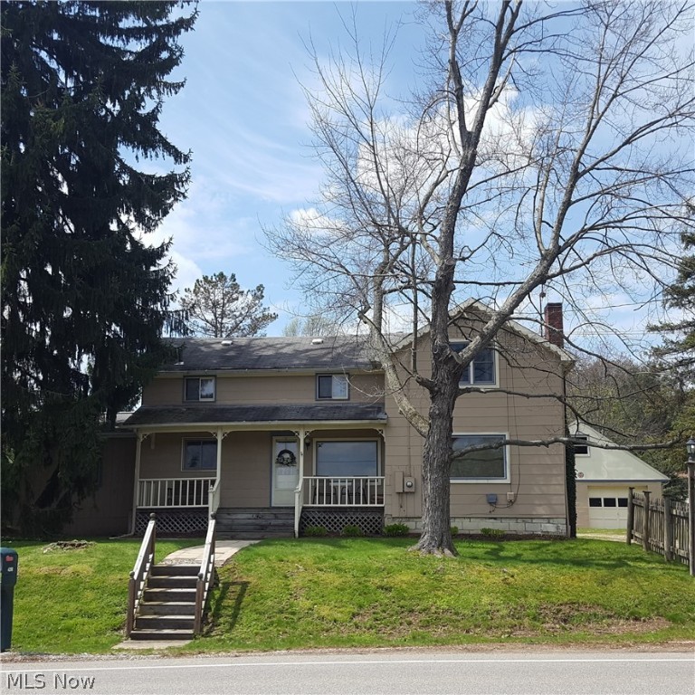 HUGE PRICE REDUCTION!!!! Wonderful opportunity for land in Stow.  This home sits on 1.79 acres and has had the same owner for approx. 60 some years!  Unique farmhouse features 1st floor laundry large country style eat in kitchen with large family room off of it which includes cathedral ceiling, ceiling fan and french doors onto back deck.  This home has a large living room, dining room and 4 bedrooms upstairs featuring another full bathroom with small sunroom and sliders onto a deck.  Sometime back in the 1900's a school house and farm house were adjoined which is why there is a staircase through the kitchen and one through the living room.  A lot of history in this home, be sure to check out picture in the kitchen of the old house.  Also featured are a front porch, back deck with awning and a 3 car garage (one entry is from the back side also stairs to an attic for storage.  There is a ton of potential here but seller will make NO REPAIRS and property is SOLD AS IS.  Don't delay give