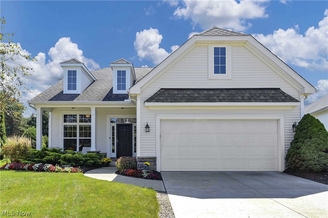 Prepare to be Moved!...by this exceptionally charming Cape Cod --spacious, well-maintained & tastefully decorated in one of the most sought-after neighborhoods in Avon Lake! The perfect blend of classic comfort & welcoming touches topped with the most desirable updates & stylish decor. The welcoming front porch leads you into the tiled foyer to the charming living room/office.  The 2-story family room and dining room have newer hardwood floors and feature walls of windows.  A terrific open concept plan, this space is perfect for entertaining! Sliding doors lead to the private back yard and patio. The eat-in kitchen combines rich-toned granite with loads of cabinetry, brand new gleaming SS appliances, center island plus a breakfast bar. A convenient half-bath is just steps away from the kitchen. First floor mudroom/laundry room combines utility & space. The 1st floor Master features an en-suite bath with dual sink vanity and shower plus walk-in closet. The second level boasts two genero